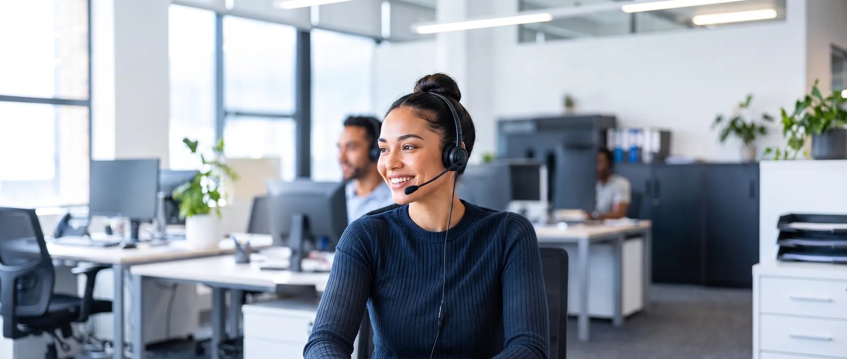 Smiling Velocity telemarketing agent wearing a headset